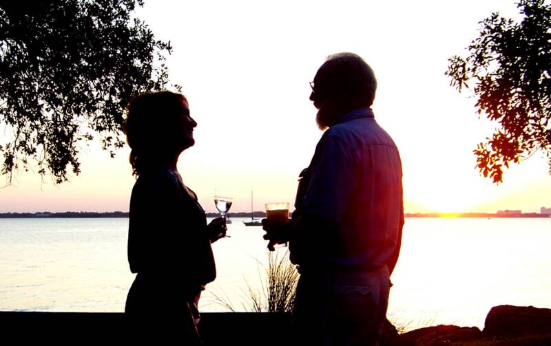 Al & Lynn enjoy a drink by the water's edge