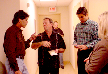 Steve Knox, Dewey Bunnel, and Larry Knox chatting back stage